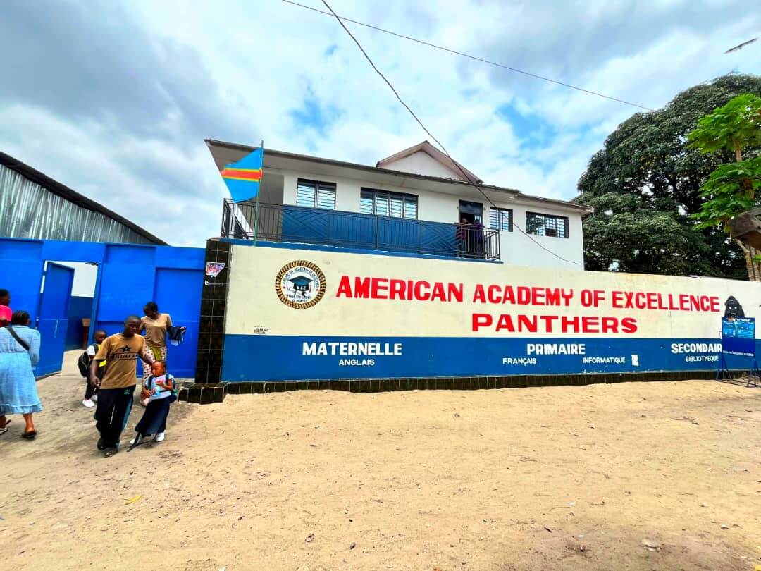 Students at American Academy of Excellence in a classroom lesson in Kinshasa